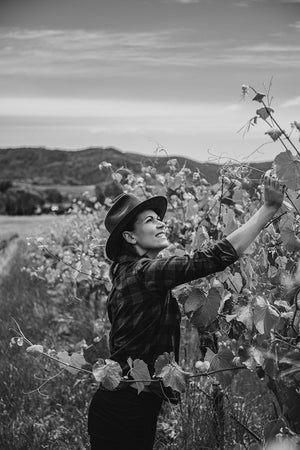 Raquel Jones from Weathercraft inspecting the vines in spring