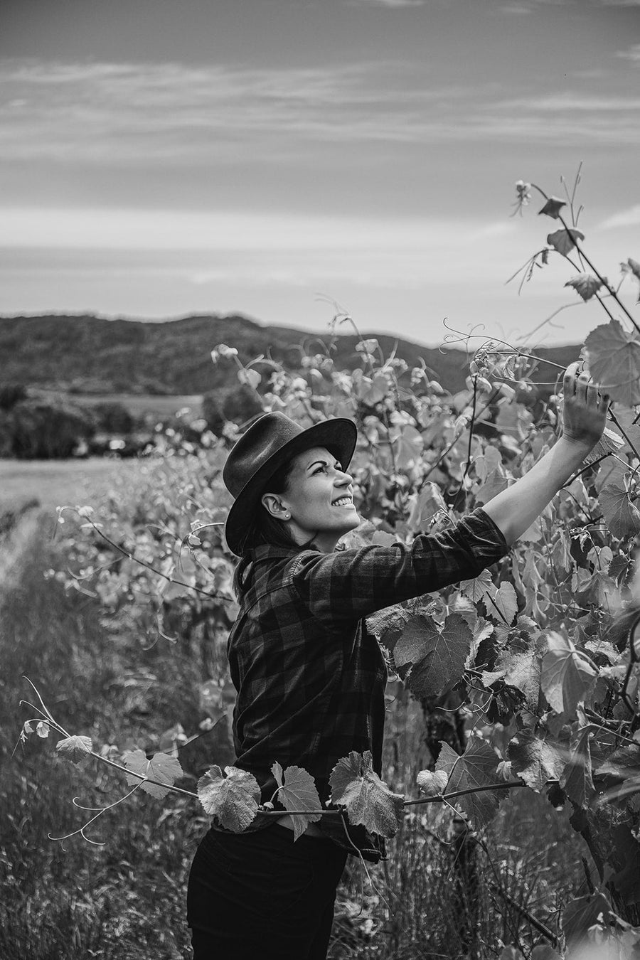 Raquel Jones from Weathercraft inspecting the vines in spring