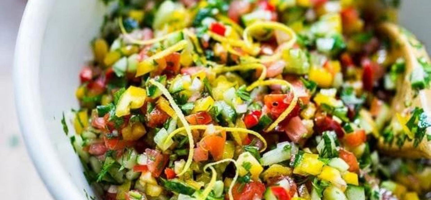 Colourful Gaudi's salad with finely diced vegetables and lemon zest