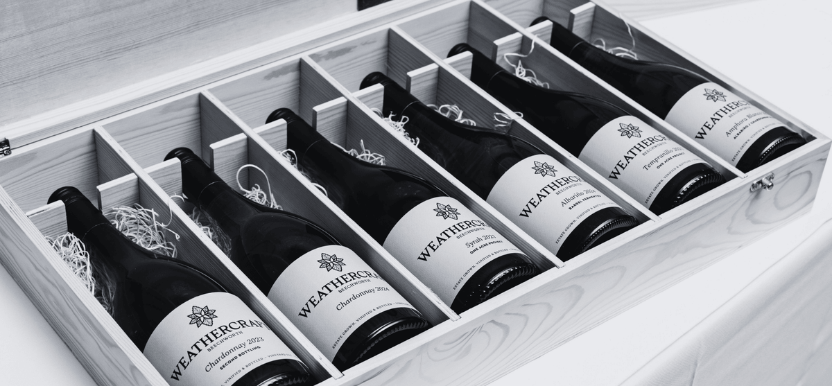 Wooden box of Weathercraft wine bottles on display